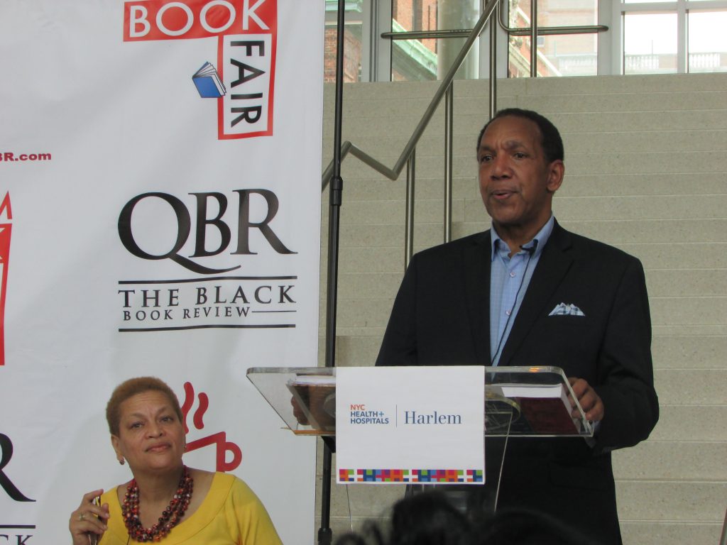 Harlem Book Fair founder Max Rodriguez (right) introduces Dr. Julianne Malveaux 